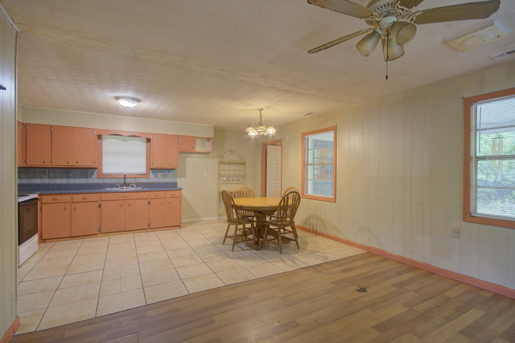 92 No-Where Road Blairsville, GA 30512 - Photo 3 of 36 a kitchen with a sink cabinets and window