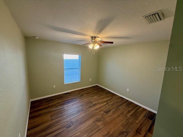 305 East Grace Street Punta Gorda, FL 33950 - Photo 5 of 14 a view of an empty room with a window
