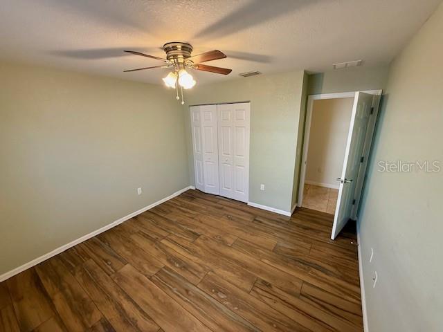 305 East Grace Street Punta Gorda, FL 33950 - Photo 6 of 14 wooden floor in an empty room