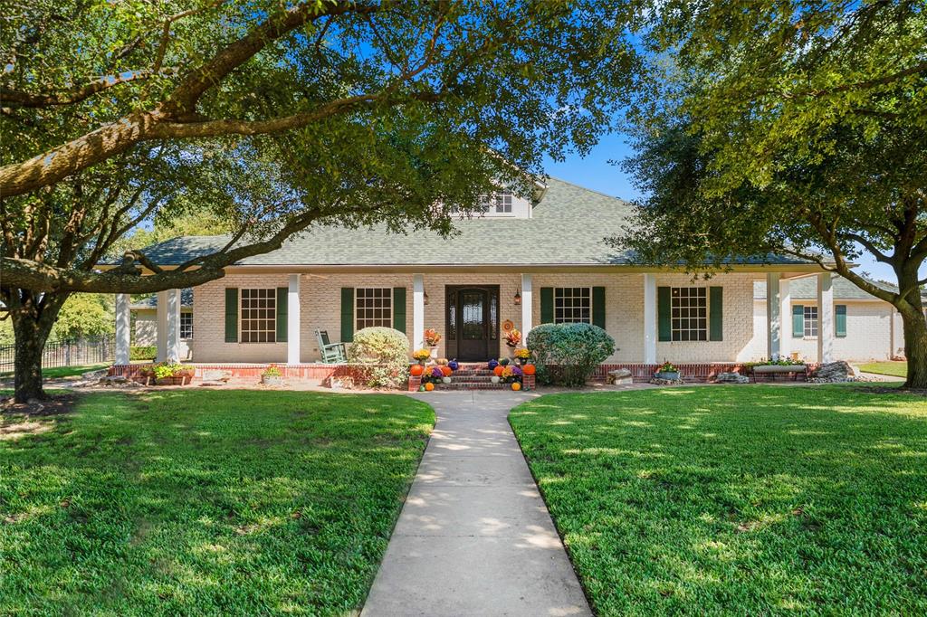 4451 Shiloh Road Midlothian, TX 76065 - Photo 1 of 39 The home features an eight foot deep covered porch with manicured shade trees. Porch covers the entire front side of home. Eight foot tall decorative steal door that features screened in side panels that open to allow fresh air into home.