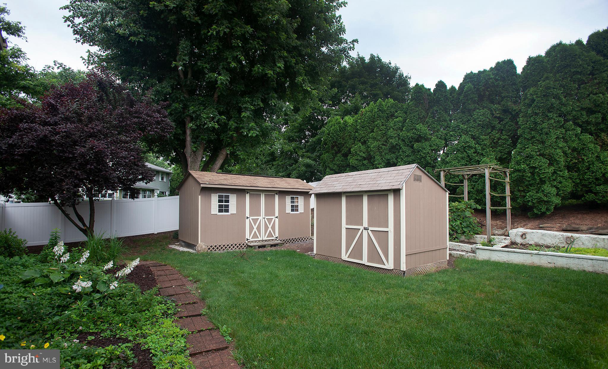 327 Windcrest Road Harrisburg, PA 17112 - Photo 32 of 34 Private backyard with 2 sheds and vinyl fence