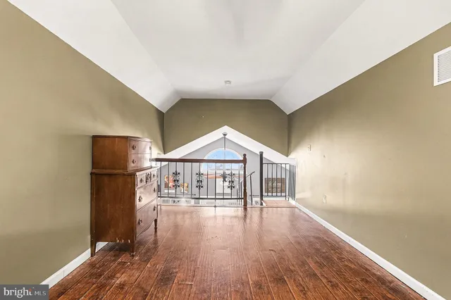 a view of a livingroom with wooden floor