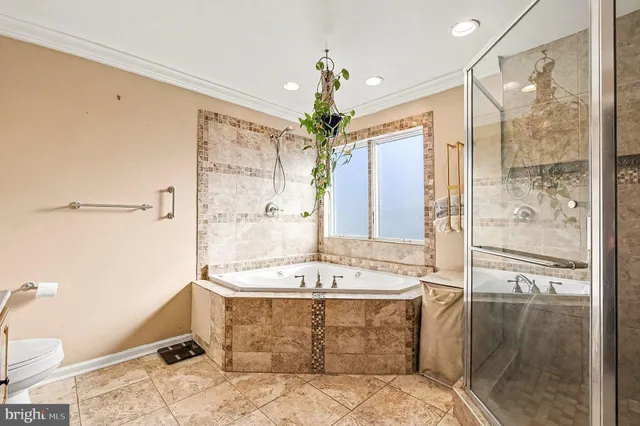 a spacious bathroom with a granite countertop sink a mirror and a shower