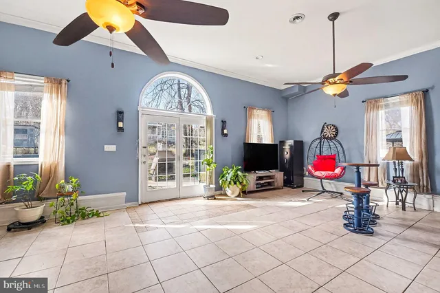 a view of lobby with furniture and chandelier