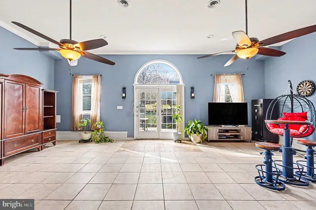 a view of a livingroom with furniture and a flat screen tv