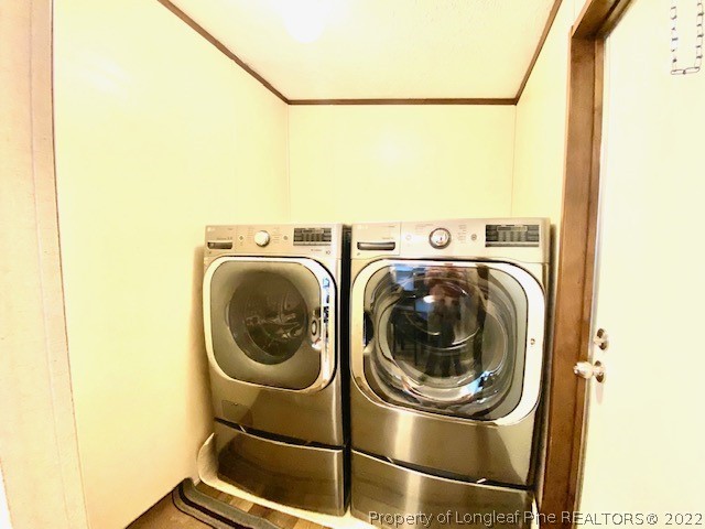 1977 Phillips Road Dunn, NC 28334 - Photo 18 of 22 a utility room with dryer and washer