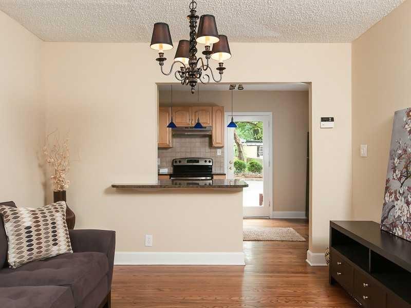 2380 Strathmore Drive Northeast Atlanta, GA 30324 - Photo 5 of 11 a living room with furniture and a chandelier