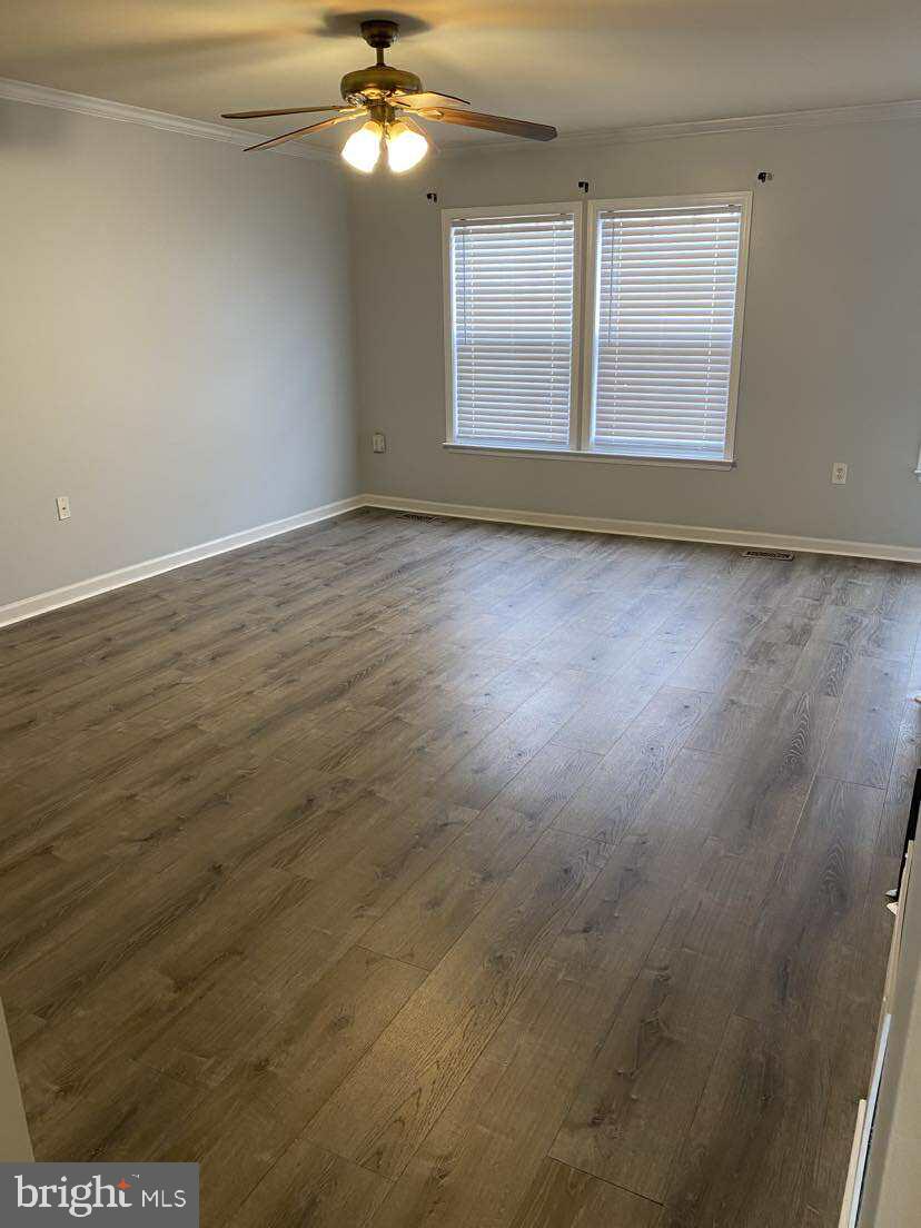 94 Eldon Drive Charles Town, WV 25414 - Photo 13 of 24 an empty room with wooden floor and windows
