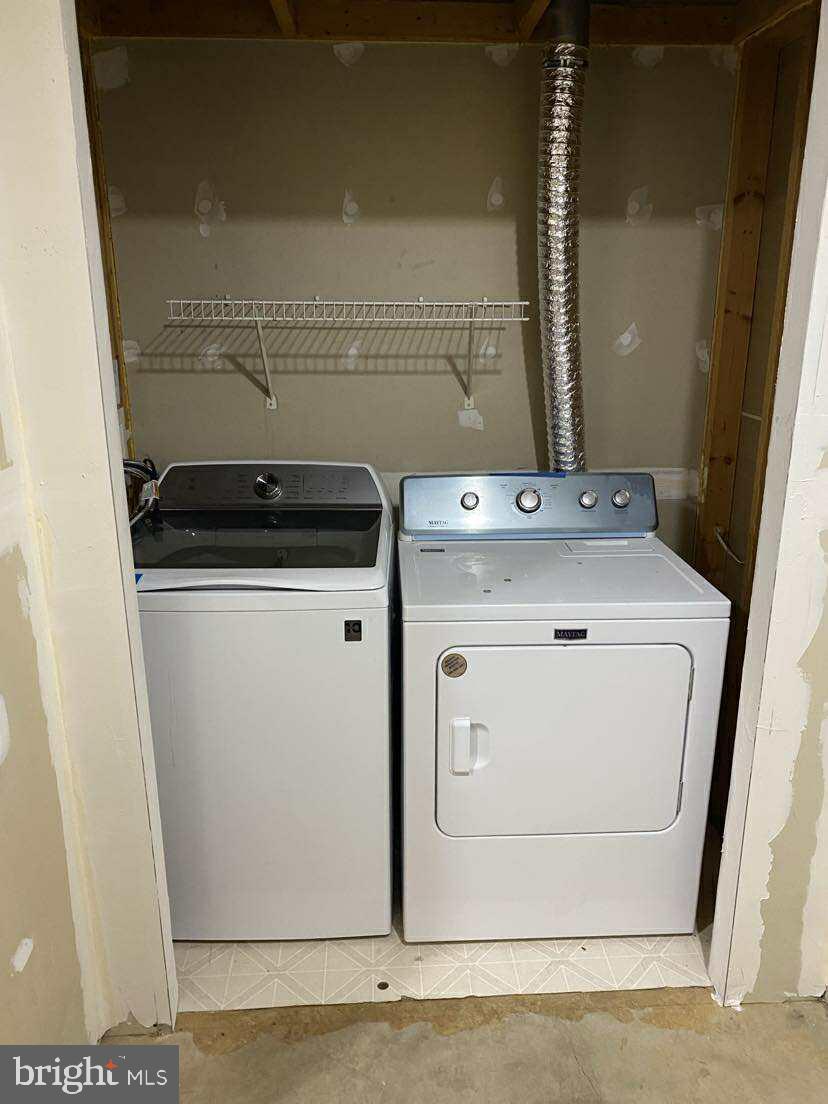 94 Eldon Drive Charles Town, WV 25414 - Photo 5 of 24 a utility room with dryer and washer