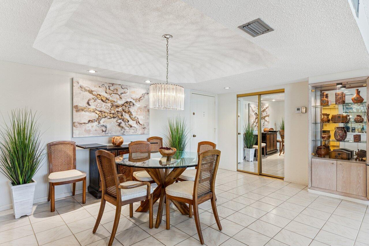 3610 South Ocean Boulevard, Unit 502 South Palm Beach, FL 33480 - Photo 14 of 51 a view of a dining room with furniture
