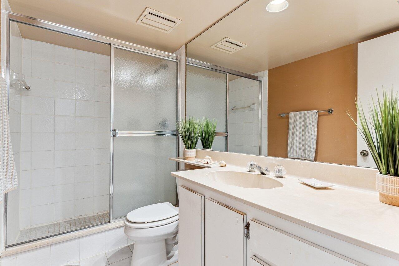 3610 South Ocean Boulevard, Unit 502 South Palm Beach, FL 33480 - Photo 29 of 51 a bathroom with a sink toilet and shower
