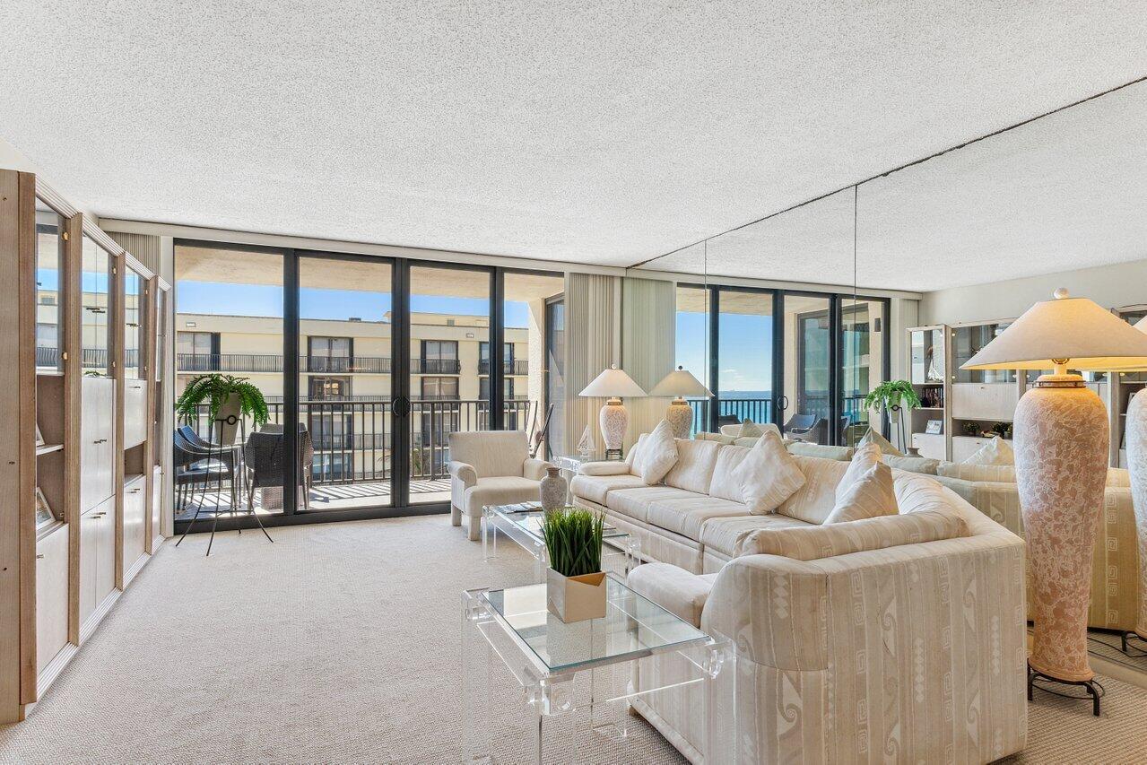 3610 South Ocean Boulevard, Unit 502 South Palm Beach, FL 33480 - Photo 10 of 51 a living room with furniture and a large window