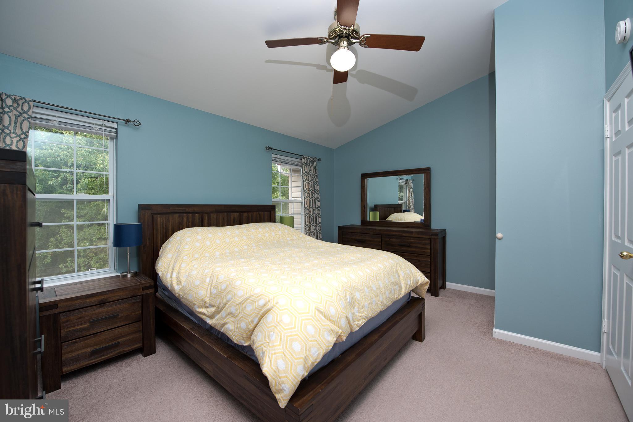 6163 Good Hunters Ride Columbia, MD 21045 - Photo 14 of 30 a large bed sitting in a bedroom next to a window