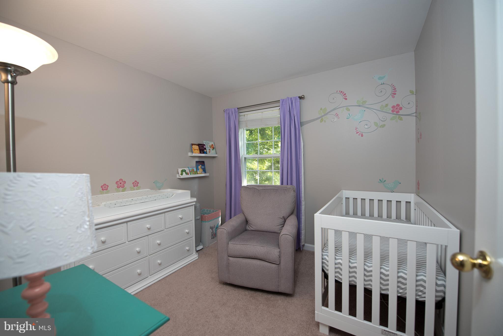6163 Good Hunters Ride Columbia, MD 21045 - Photo 18 of 30 a bedroom with a bed and a couch