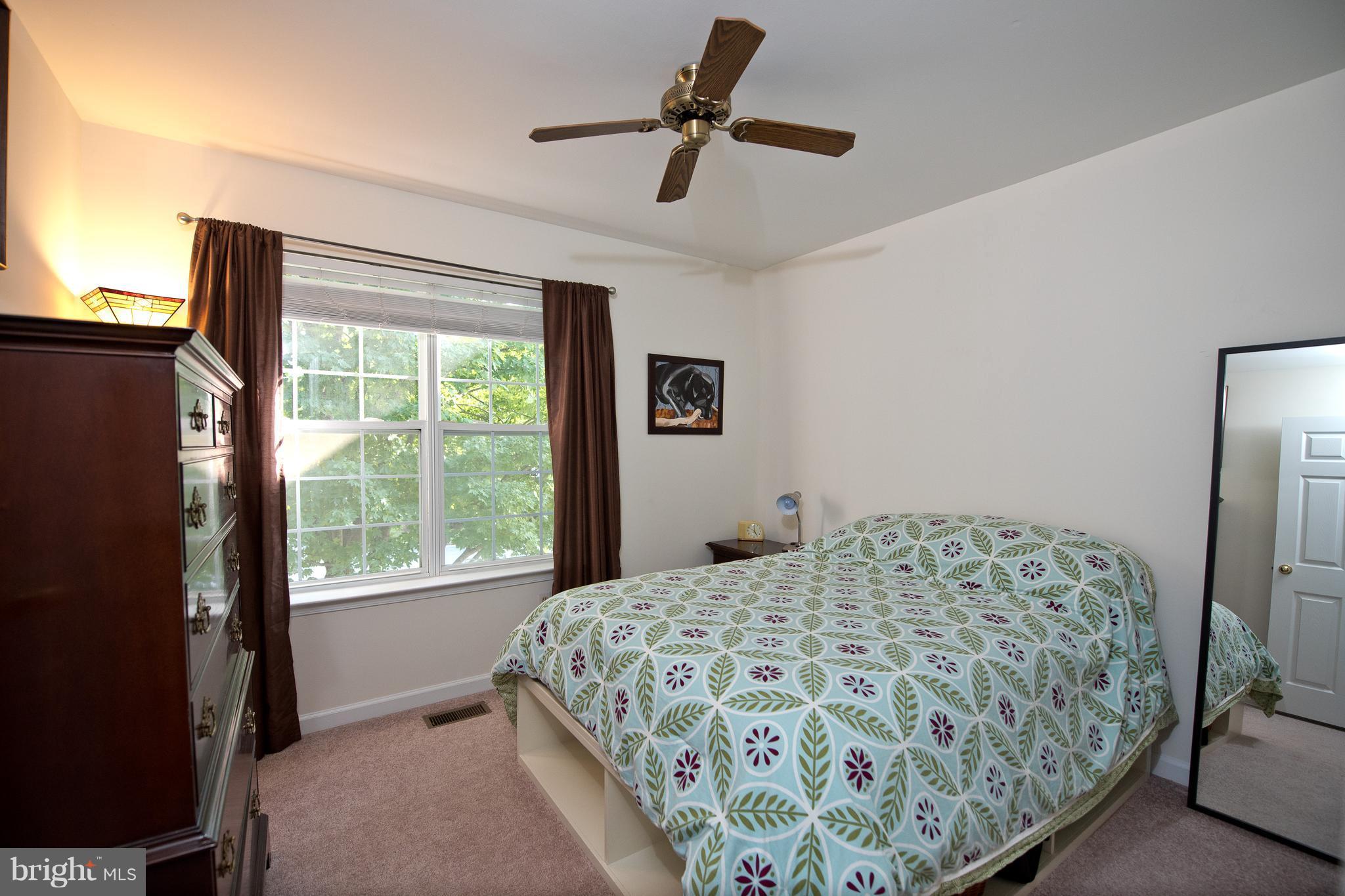 6163 Good Hunters Ride Columbia, MD 21045 - Photo 19 of 30 a bedroom with a bed and a window