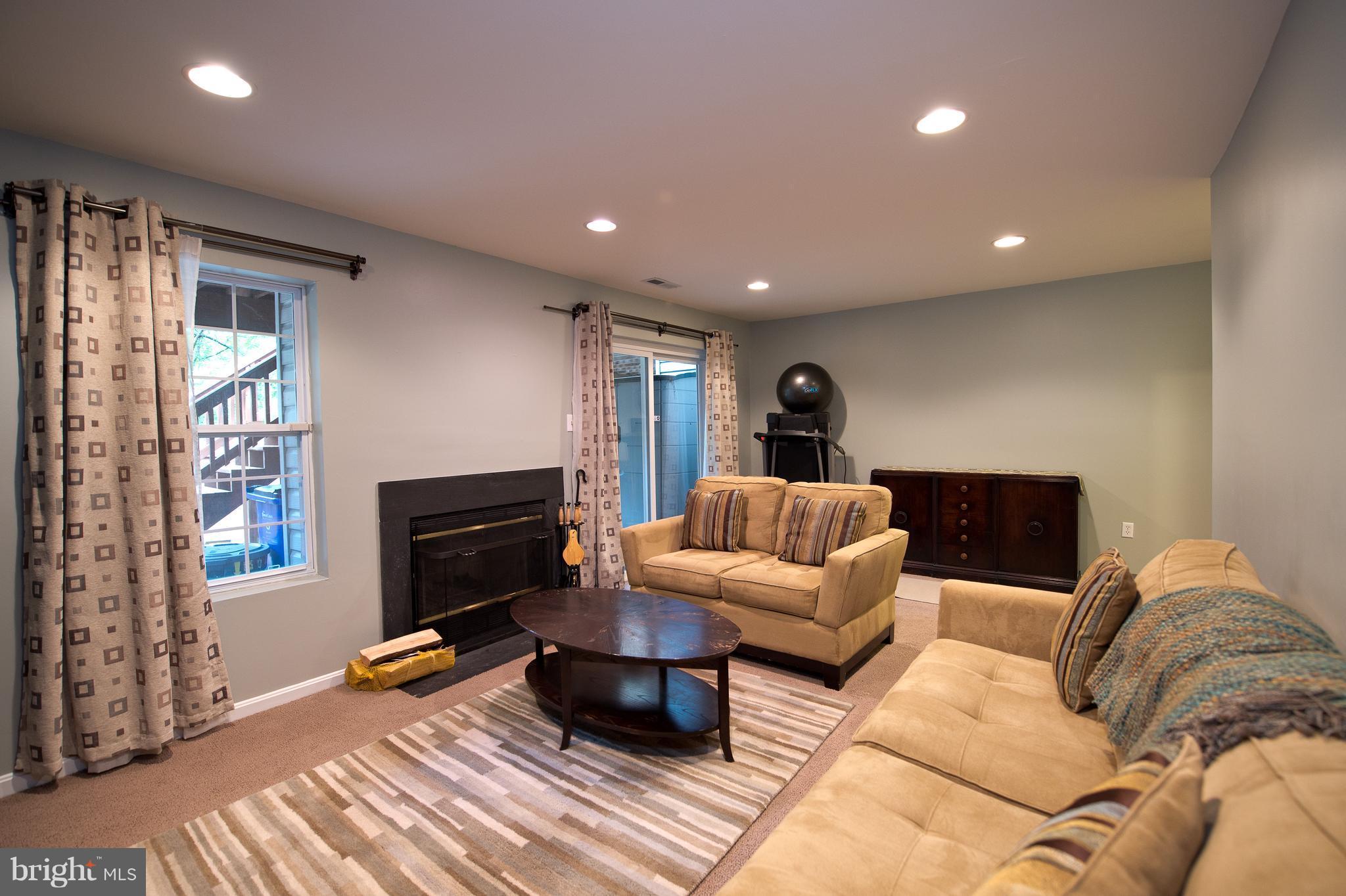 6163 Good Hunters Ride Columbia, MD 21045 - Photo 21 of 30 a bedroom with furniture and a fireplace