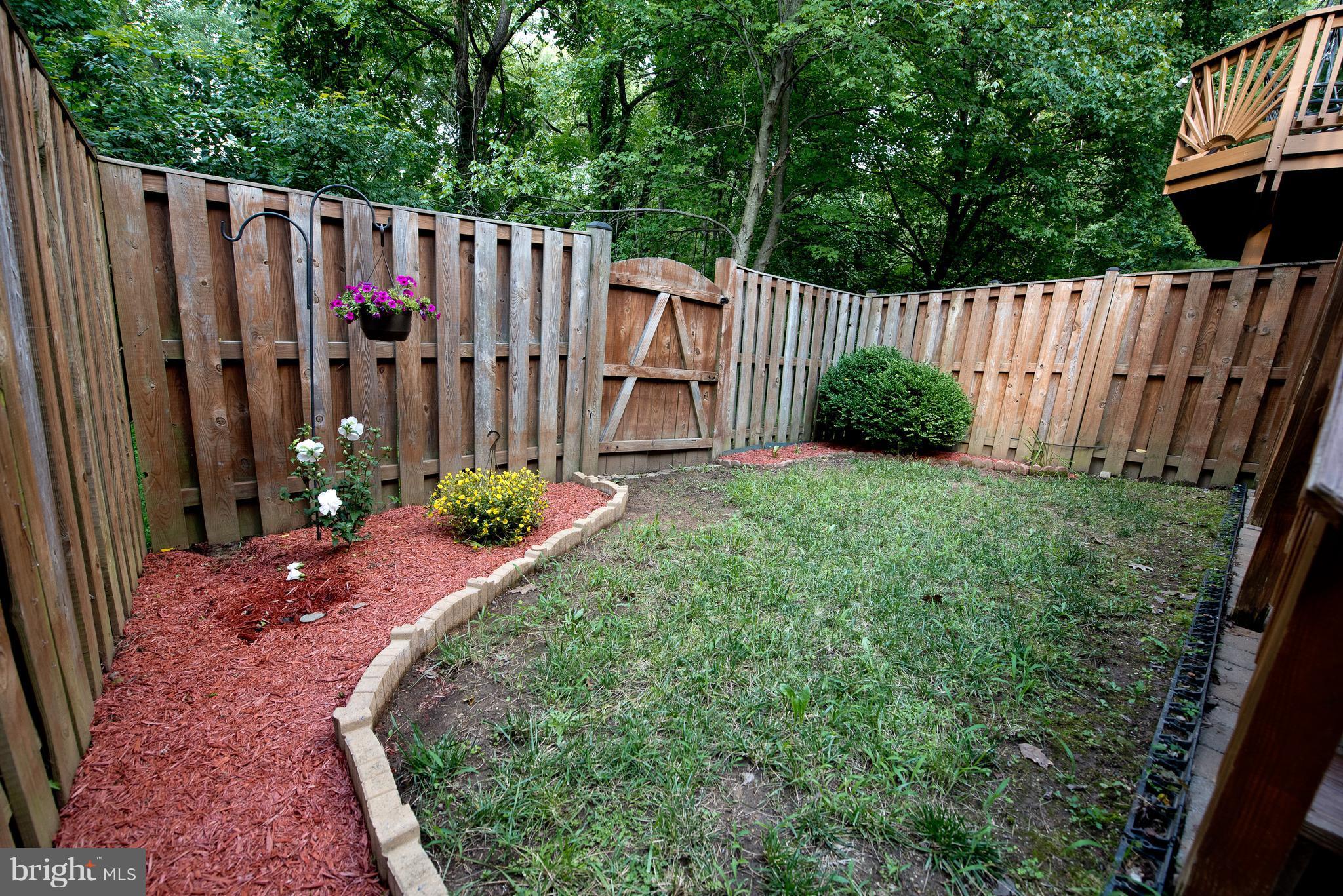 6163 Good Hunters Ride Columbia, MD 21045 - Photo 29 of 30 a view of a backyard with wooden fence
