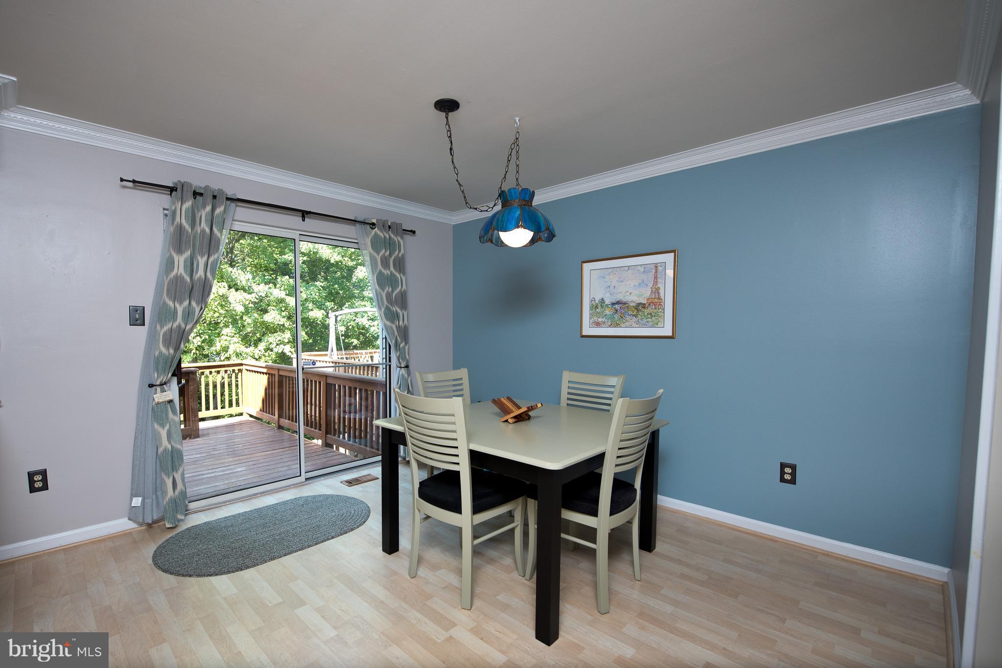 6163 Good Hunters Ride Columbia, MD 21045 - Photo 7 of 30 a view of a dining room with furniture window and outside view