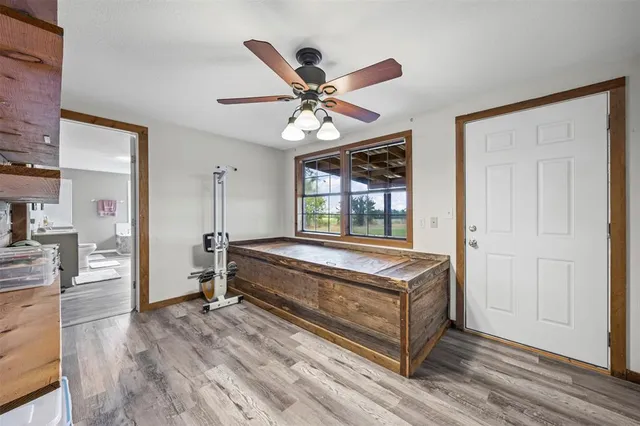 a living room with a bed furniture and a window