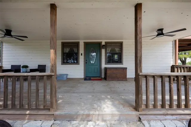a view of a porch with wooden floor