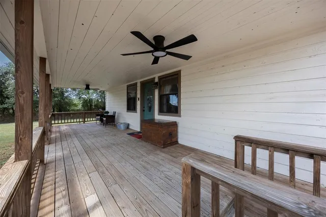 a view of a balcony with wooden floor