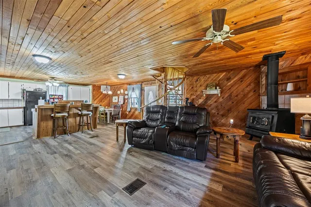 a living room with lots of furniture and gym equipment