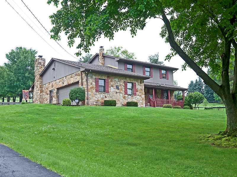 185 Brehm Road Washington, PA 15301 - Photo 22 of 22 Exterior Front. Stone and cedar home with covered front porch&attached garage.