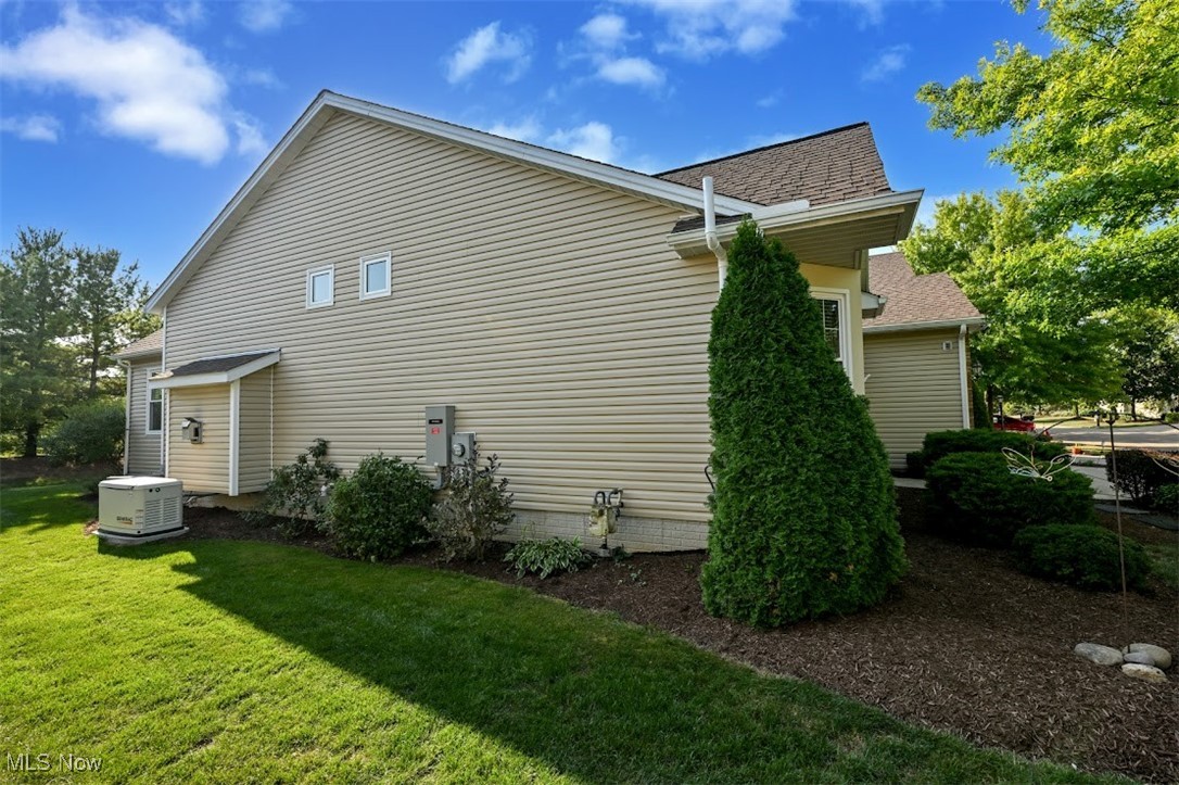 4902 Foote Road, Unit 33 Medina, OH 44256 - Photo 46 of 46 View of property exterior with a lawn