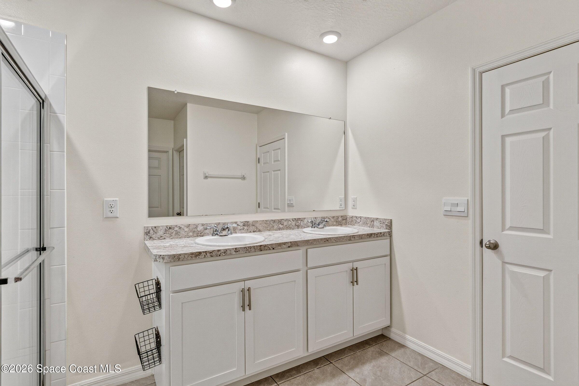 3419 Foggy Mist Road Southeast Palm Bay, FL 32909 - Photo 11 of 39 Primary Bathroom