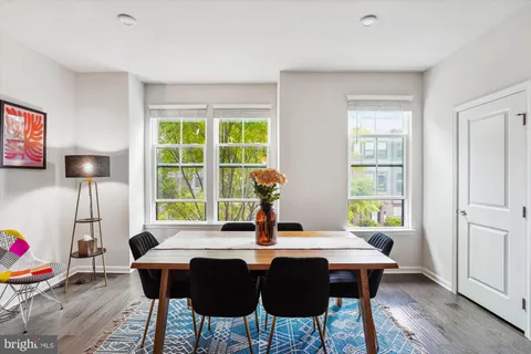 a bathroom with a double vanity sink toilet mirror and shower