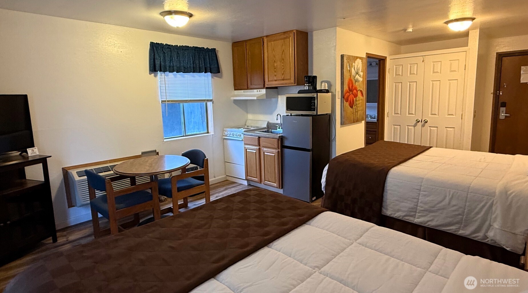 1120 North 91st Street Seattle, WA 98103 - Photo 12 of 23 a bedroom with a bed and a television