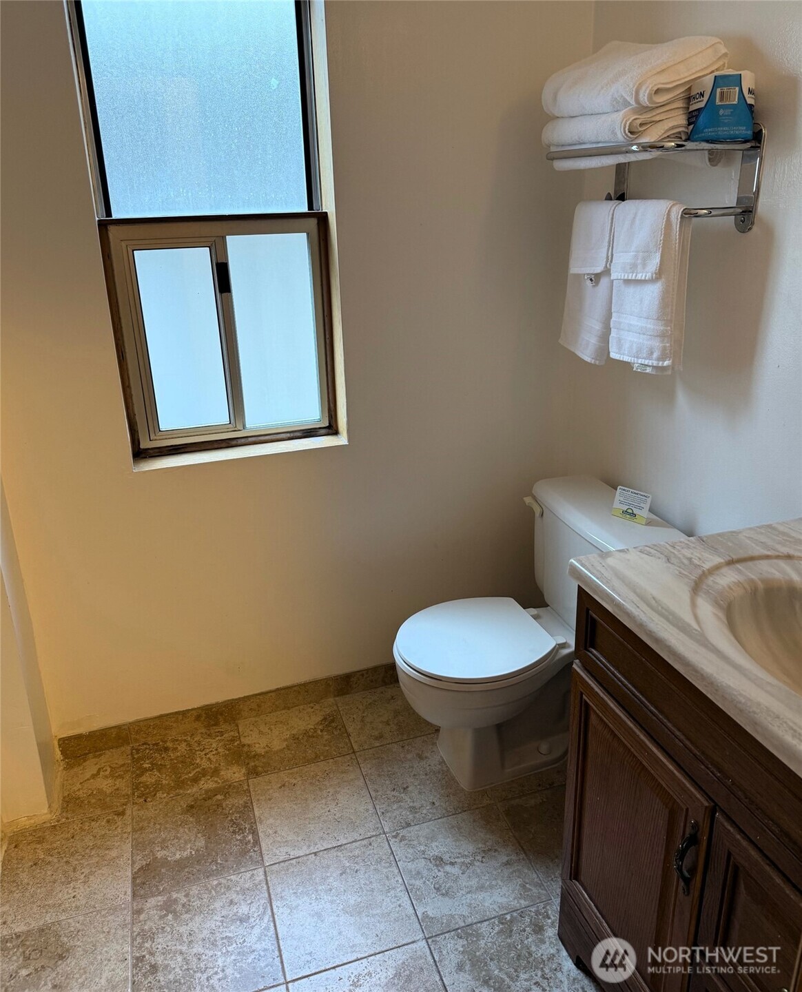 1120 North 91st Street Seattle, WA 98103 - Photo 17 of 23 a bathroom with a granite countertop toilet and a sink