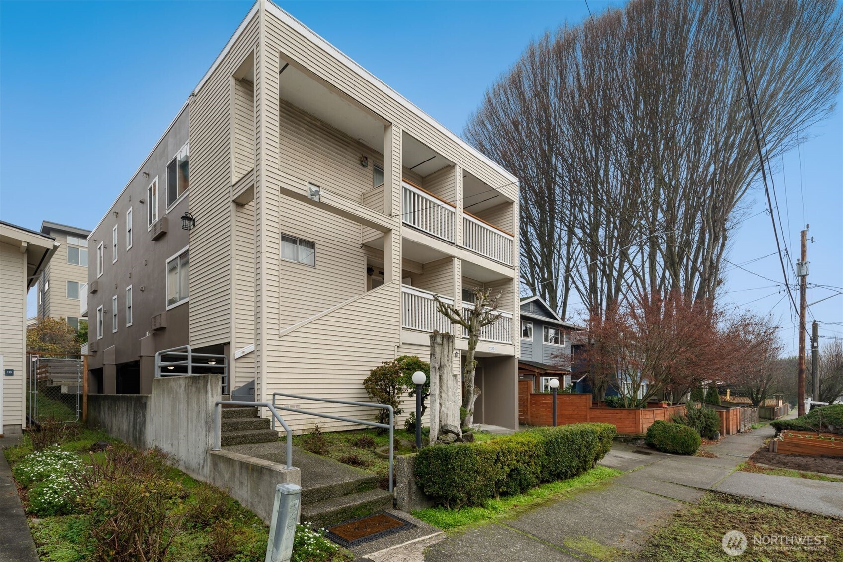 1120 North 91st Street Seattle, WA 98103 - Photo 2 of 23 a view of a building with many windows