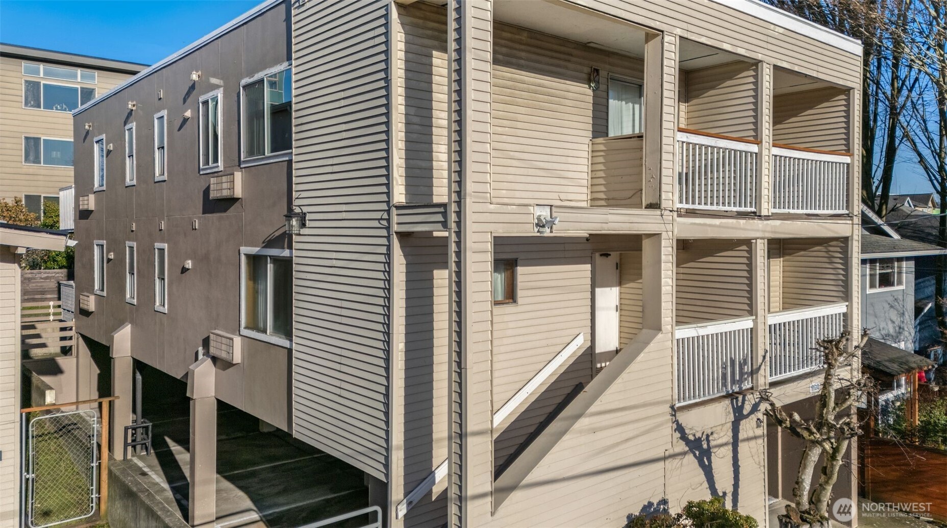 1120 North 91st Street Seattle, WA 98103 - Photo 6 of 23 a view of a house with many windows