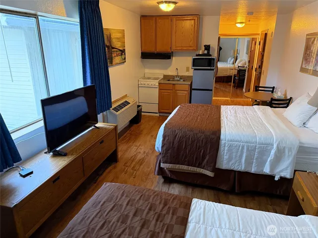 a bedroom with a bed and furniture