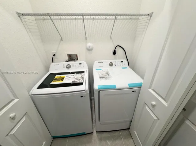 a utility room with dryer and washer
