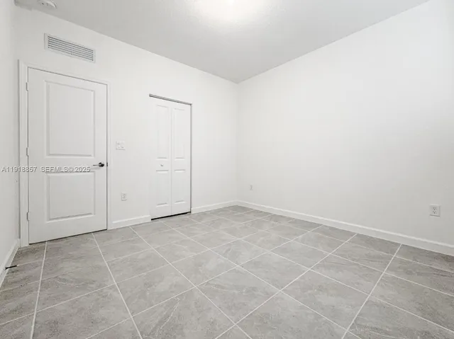 an empty room with white door