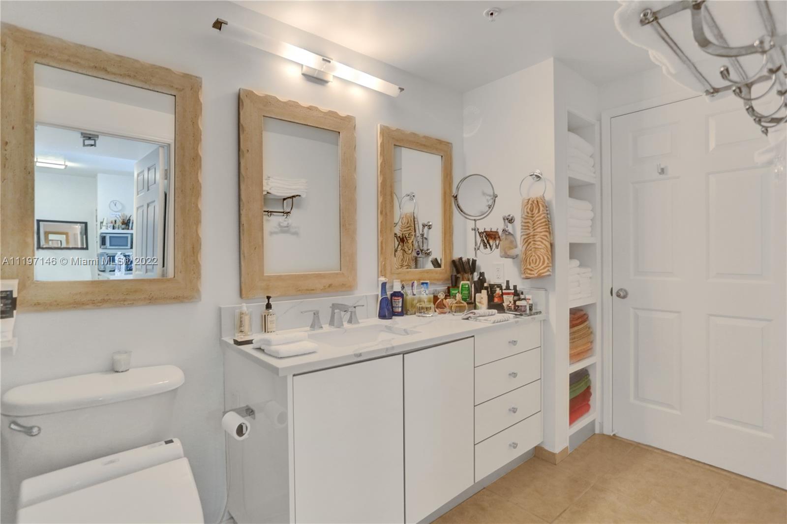 Imperial Point Fort Lauderdale, FL 33308 - Photo 11 of 37 a bathroom with a double vanity sink mirror and toilet