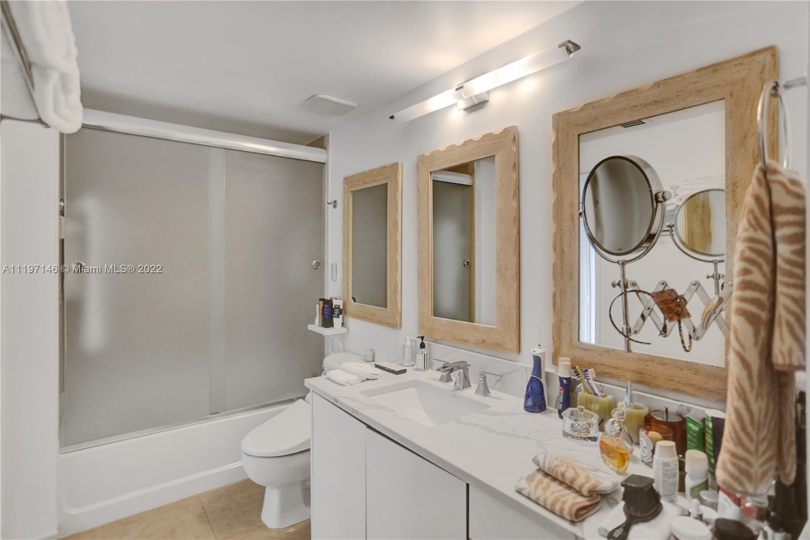 Imperial Point Fort Lauderdale, FL 33308 - Photo 12 of 37 a bathroom with a granite countertop sink and a mirror