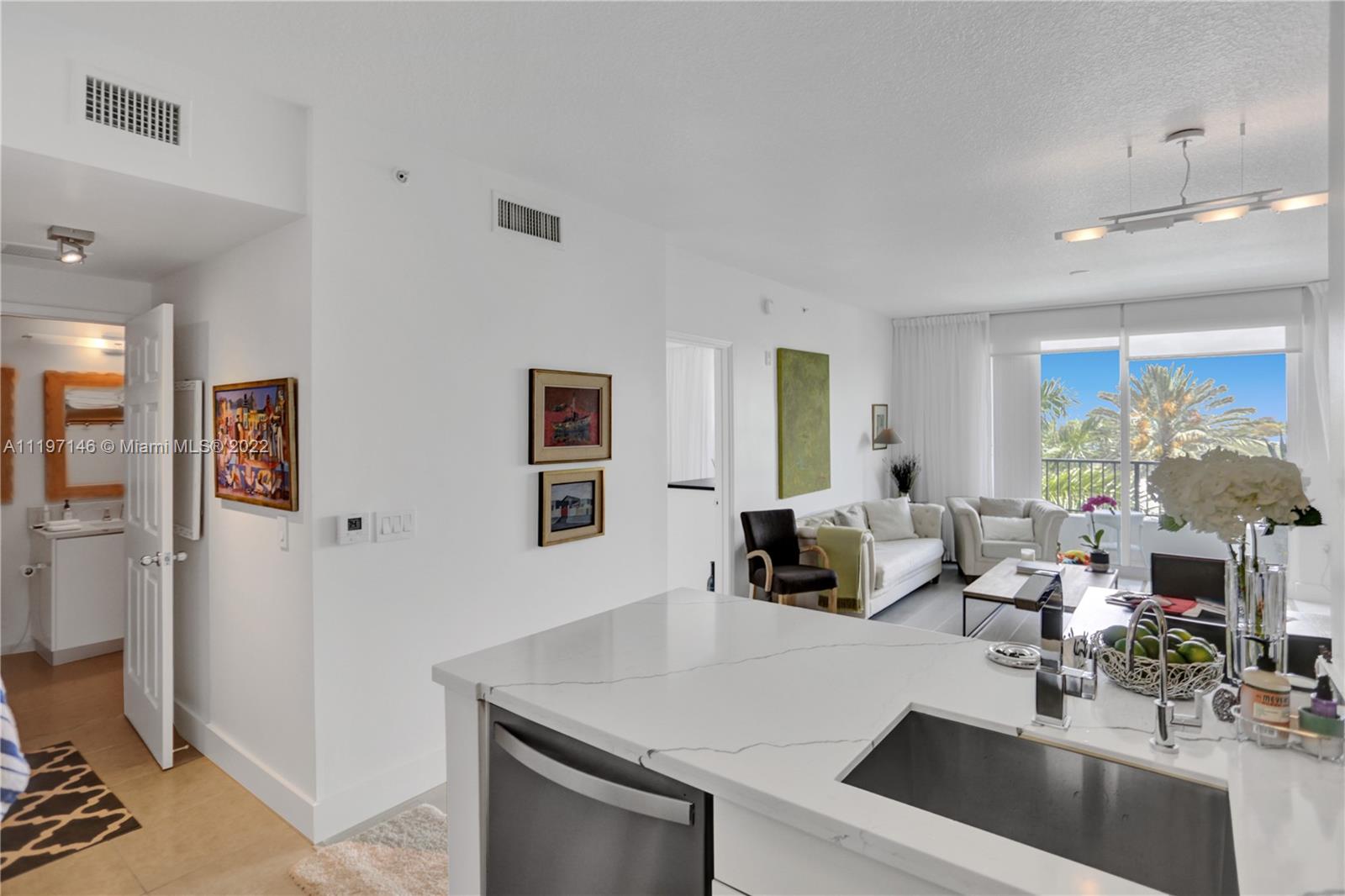 Imperial Point Fort Lauderdale, FL 33308 - Photo 22 of 37 a living room with furniture and a flat screen tv
