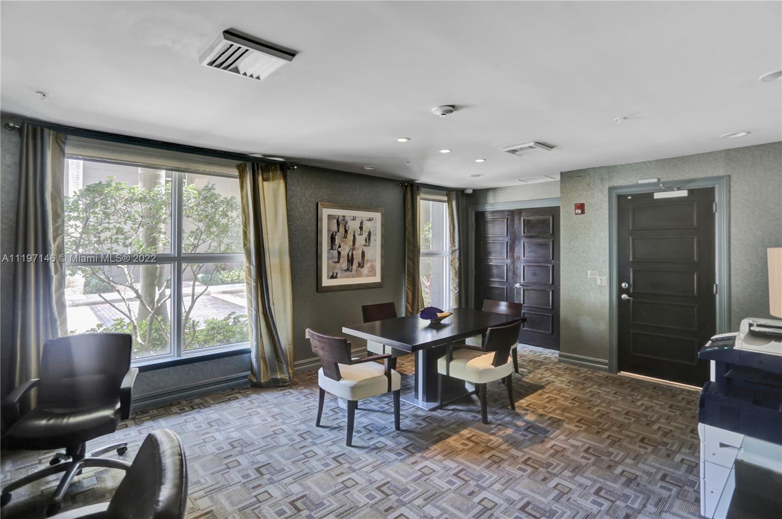 Imperial Point Fort Lauderdale, FL 33308 - Photo 28 of 37 a living room with furniture and large windows