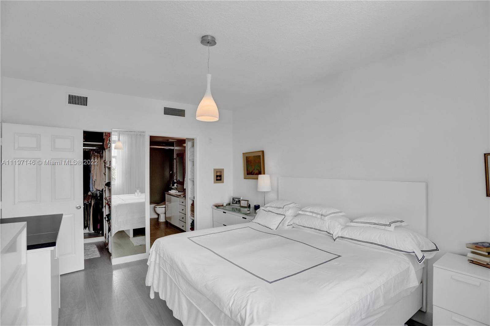 Imperial Point Fort Lauderdale, FL 33308 - Photo 8 of 37 a bed room with a bed and a view of living room