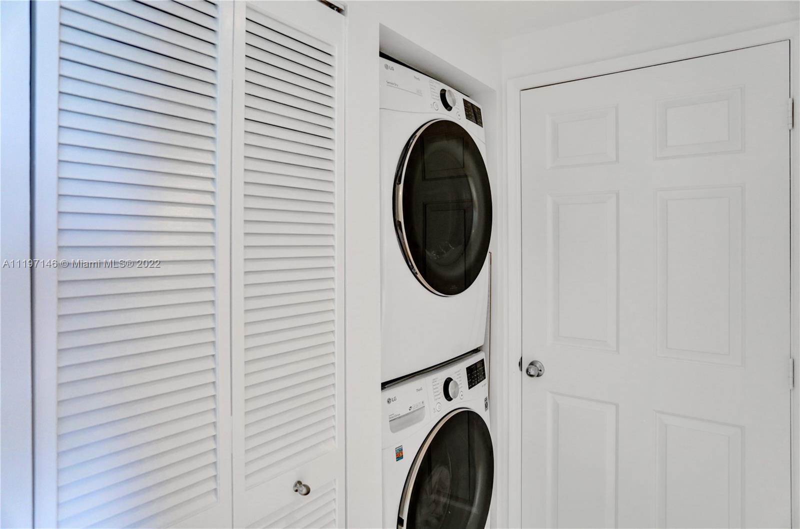Imperial Point Fort Lauderdale, FL 33308 - Photo 9 of 37 a utility room with dryer and washer