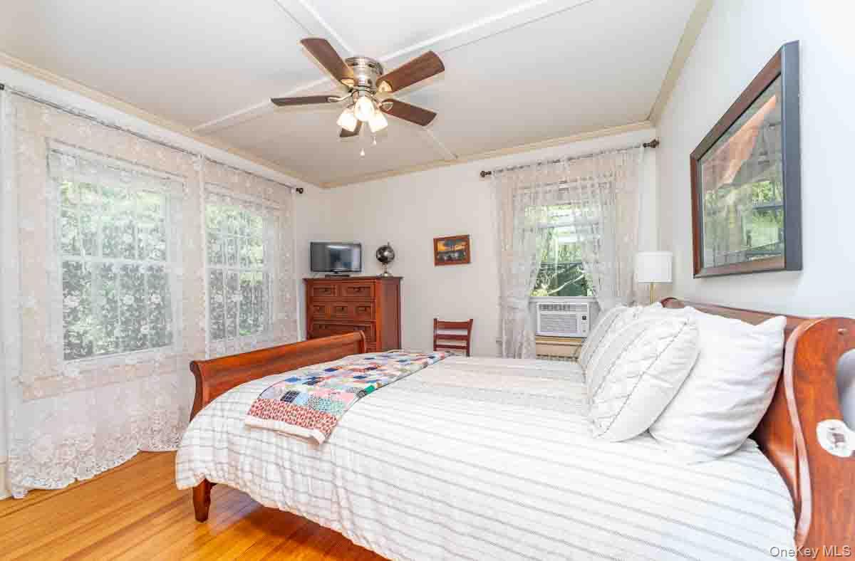 145 Drake Road Pleasant Valley, NY 12569 - Photo 23 of 47 Wood-finish flooring with multiple windows and a ceiling fan