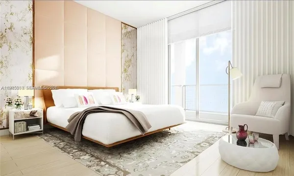 a spacious bedroom with a bed and a couch