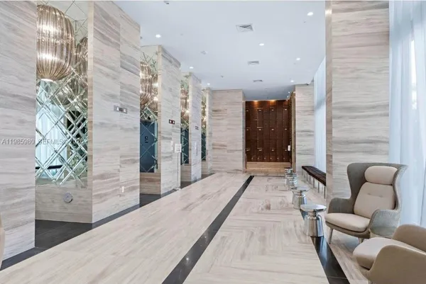 a hallway with furniture and wooden floor
