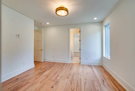 a kitchen with a sink cabinets stainless steel appliances and a window