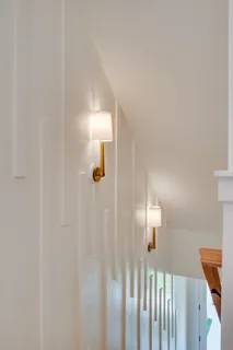 a large kitchen with granite countertop a stove a sink and a wooden floors