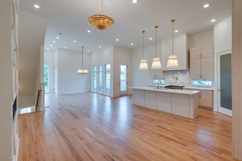 a view of a house with a yard and a garage