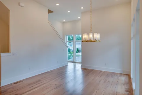 a bathroom with a granite countertop sink mirror and shower